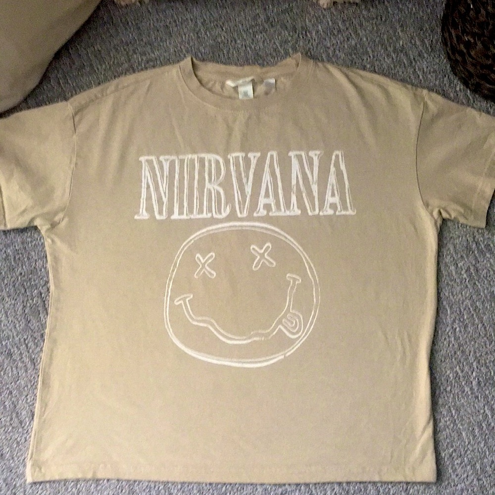 Cream graphic tee with Nirvana and a dead smiling face